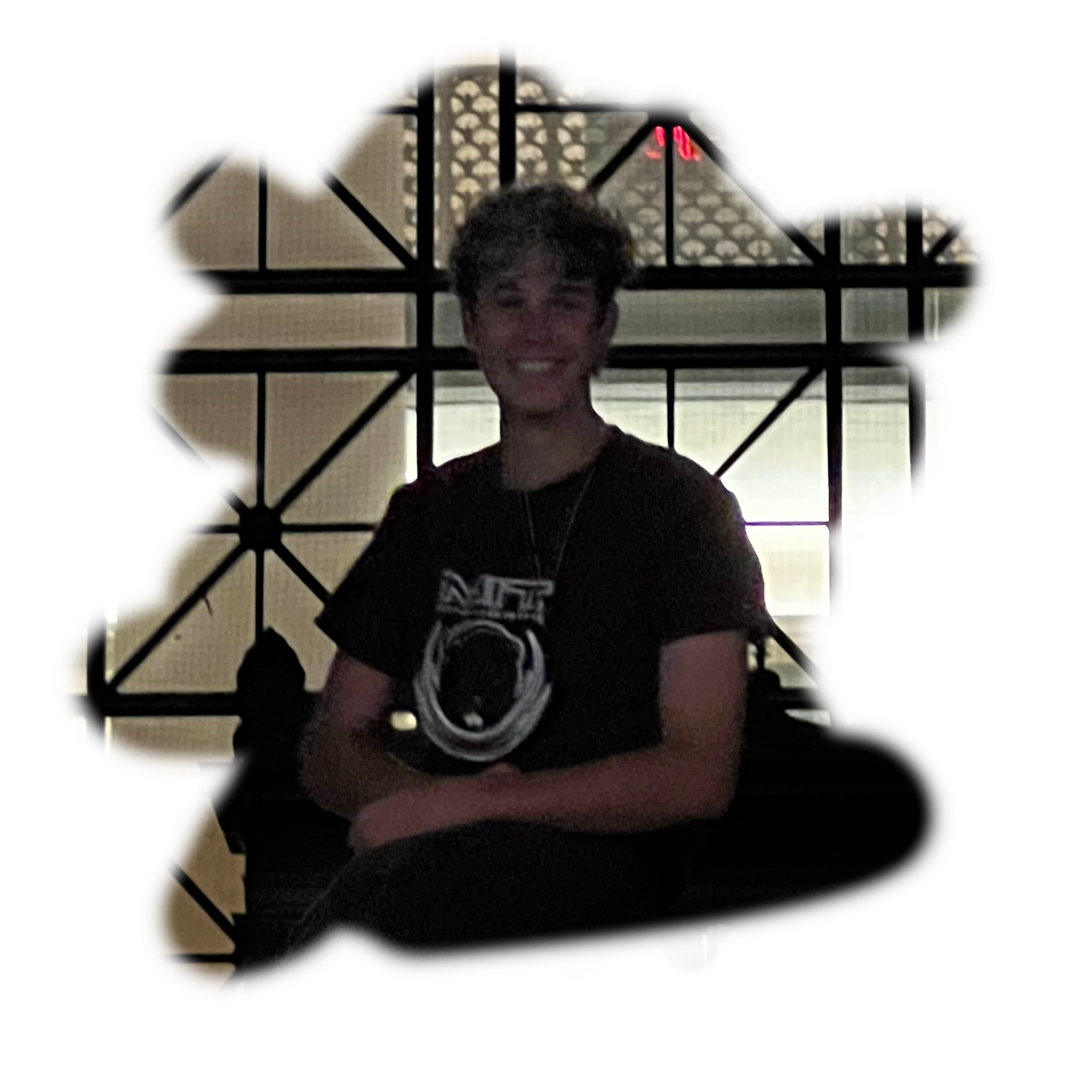 Tye sitting in front of MIT